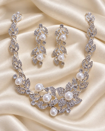 Ivy silver leaf and pearl jewellery set arranged on ivory satin