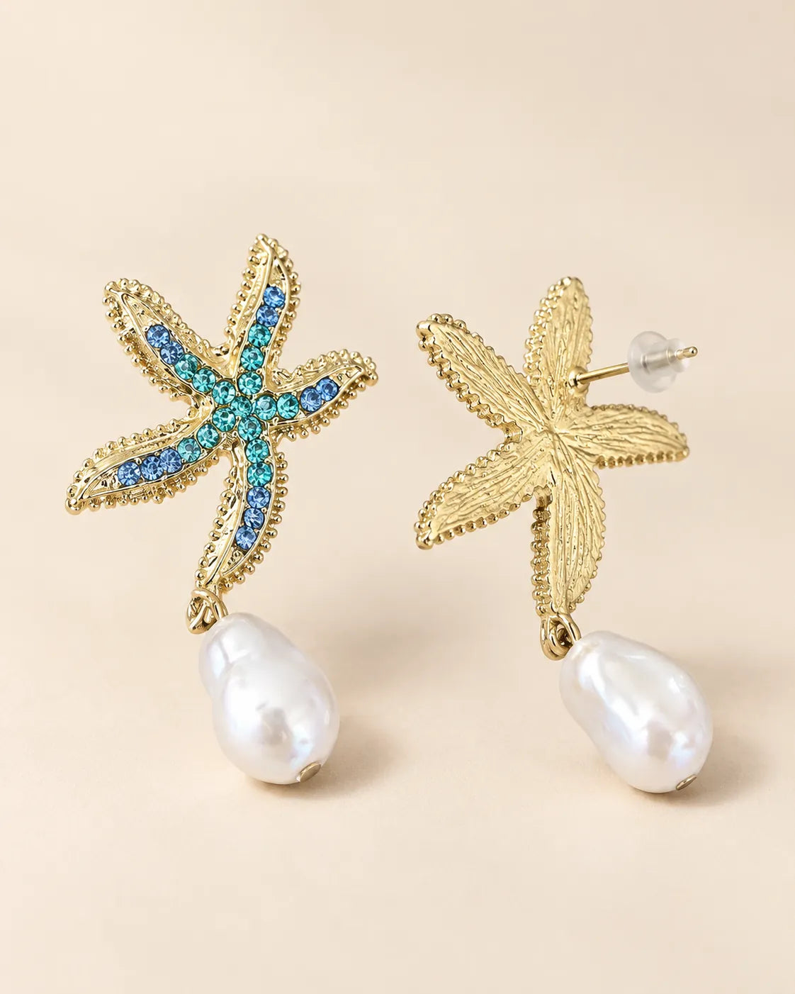 Front and back view of the gold-tone starfish pearl-look drop earrings