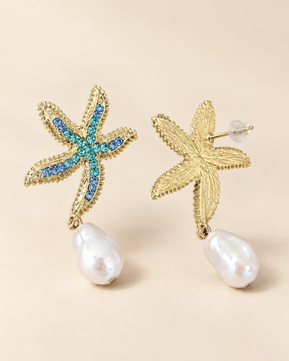 Front and back view of the gold-tone starfish pearl-look drop earrings