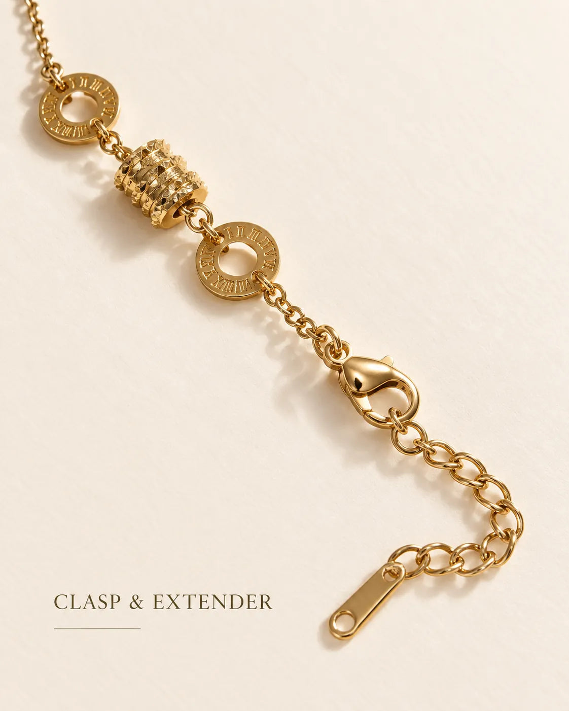 Gold Roman numeral drum bracelet showing the lobster clasp and extender