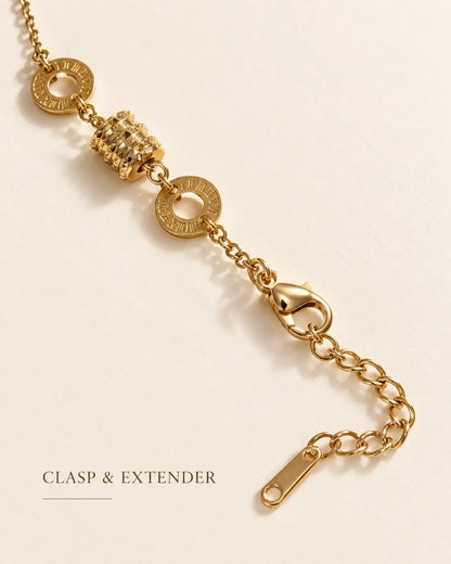 Gold Roman numeral drum bracelet showing the lobster clasp and extender