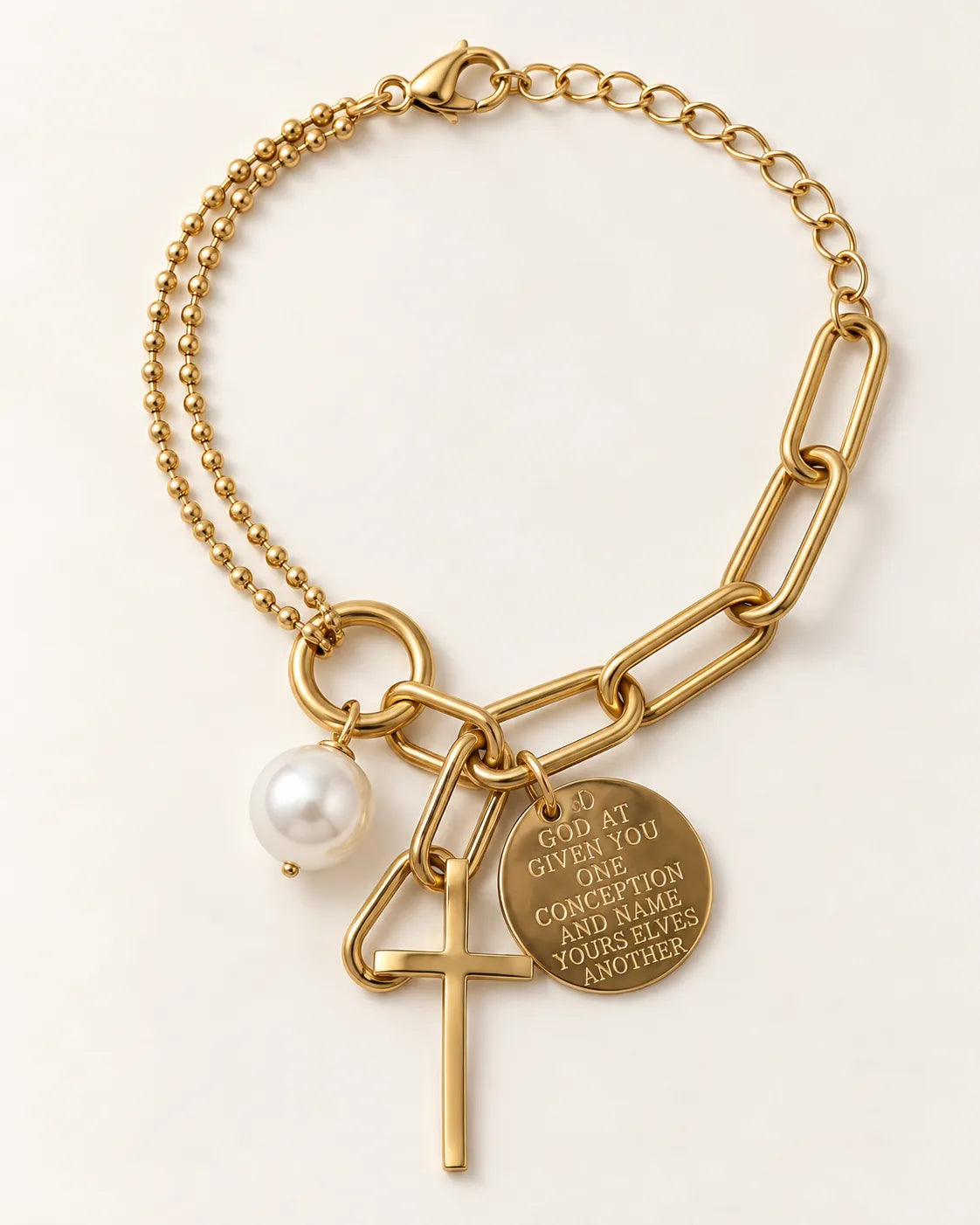 Gold paperclip and bead chain bracelet with cross, coin and pearl-look charms