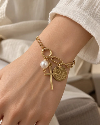 Wrist wearing the gold link chain cross charm bracelet