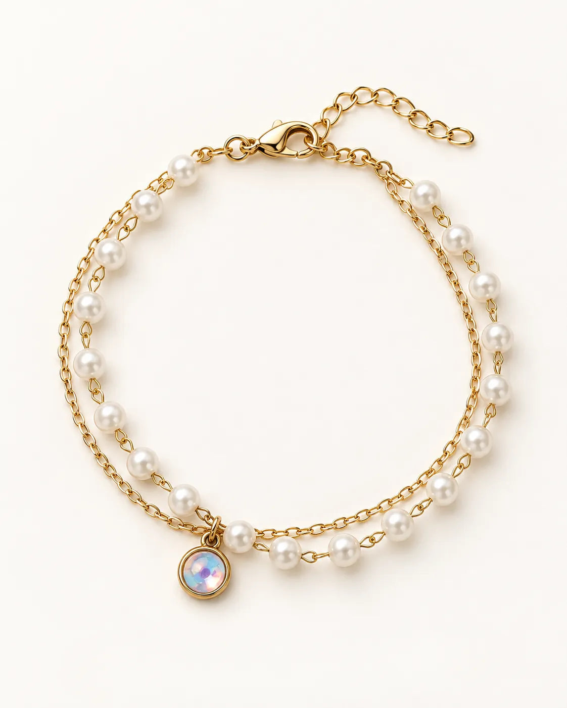 Gold double bracelet with fine chain, pearl-look beads and opal-look charm