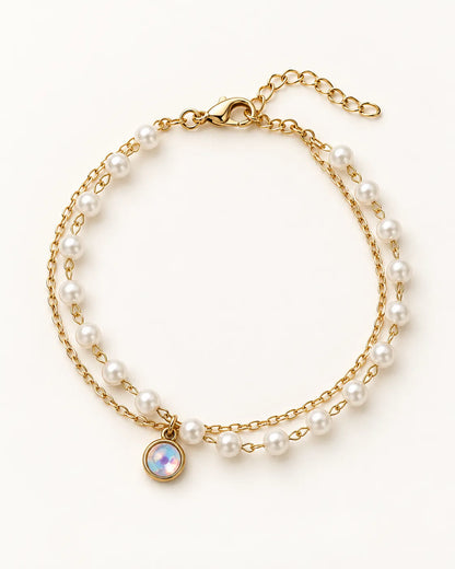 Gold double bracelet with fine chain, pearl-look beads and opal-look charm