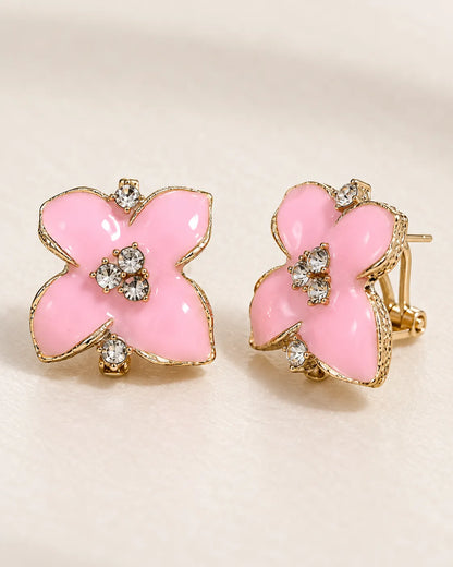 Angled pair of pink camellia studs showing the clip-style back