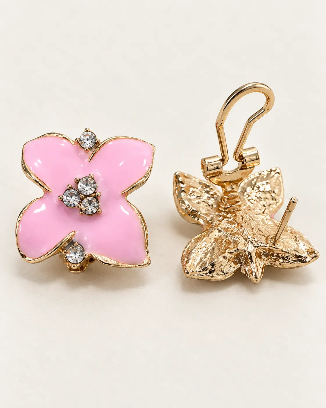 Pink camellia stud front beside its gold-tone back with the lever open