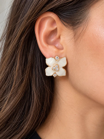 Close-up of the white camellia flower stud worn on the ear