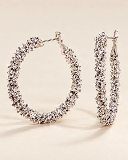 Silver crystal cluster hoops shown from the front and the side
