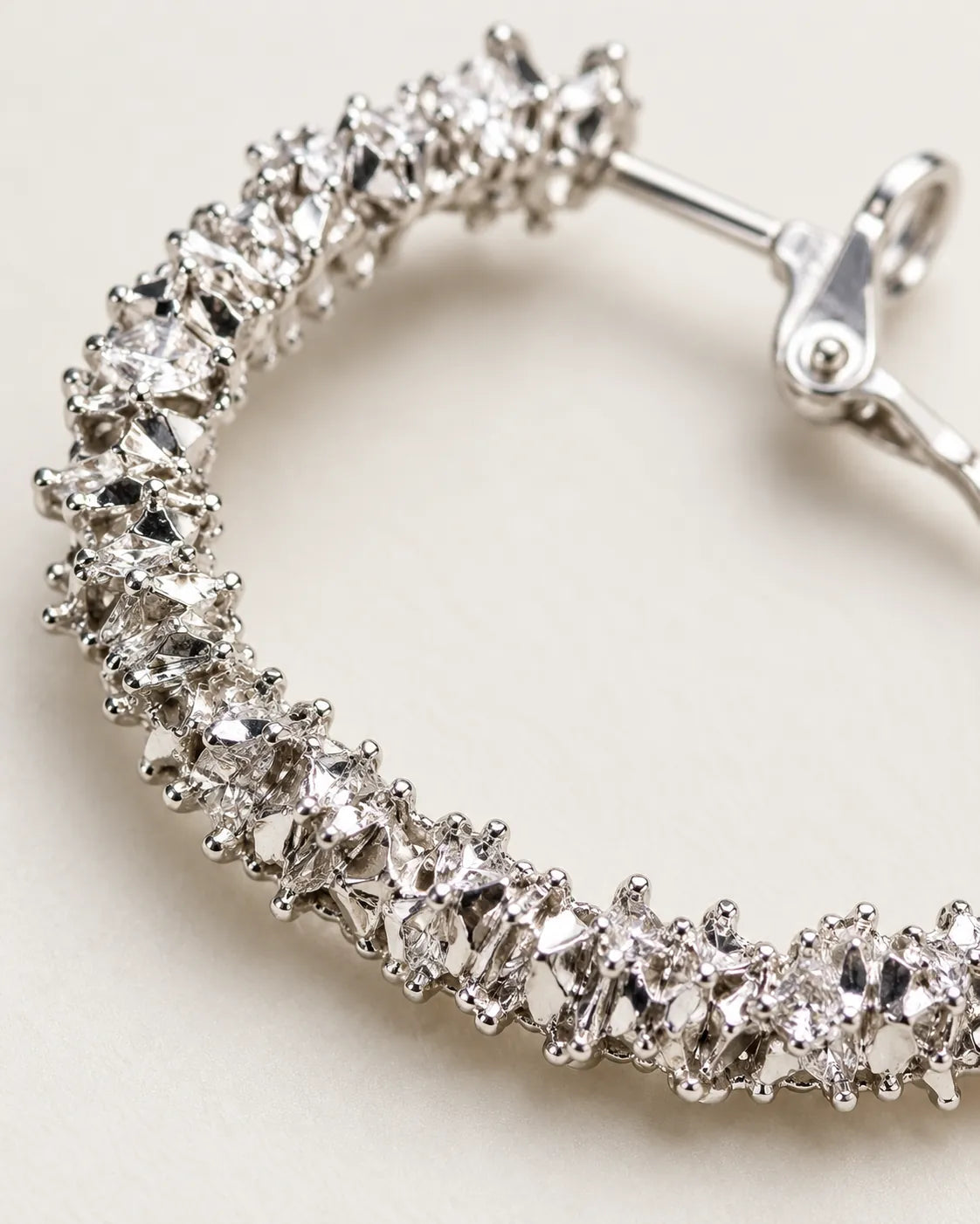 Close-up of the clustered clear crystals and post on the silver hoop