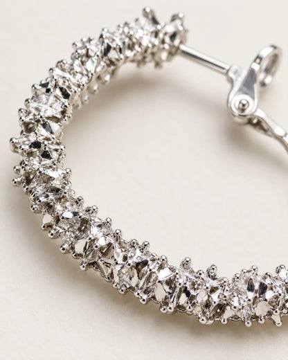 Close-up of the clustered clear crystals and post on the silver hoop