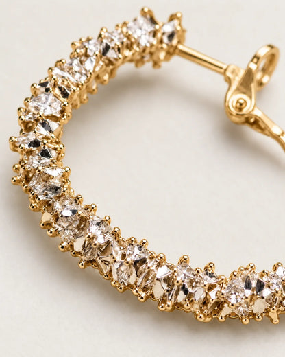 Close-up of the clustered clear crystals and post on the gold hoop