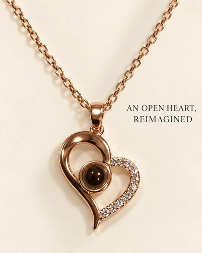 Rose gold open heart necklace with An Open Heart, Reimagined text