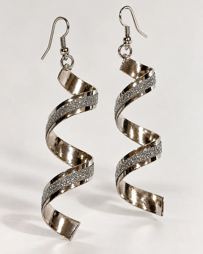 Silver-tone spiral frosted drop earrings hanging on a pale background