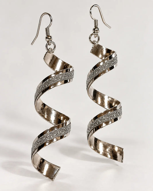 Silver-tone spiral frosted drop earrings hanging on a pale background