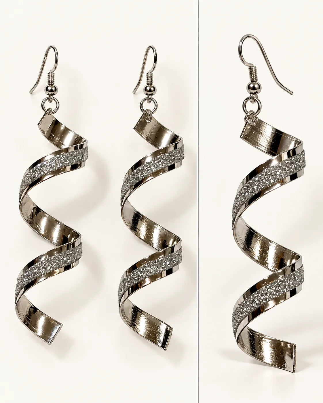Pair of silver corkscrew spiral earrings on cream showing the frosted stripe