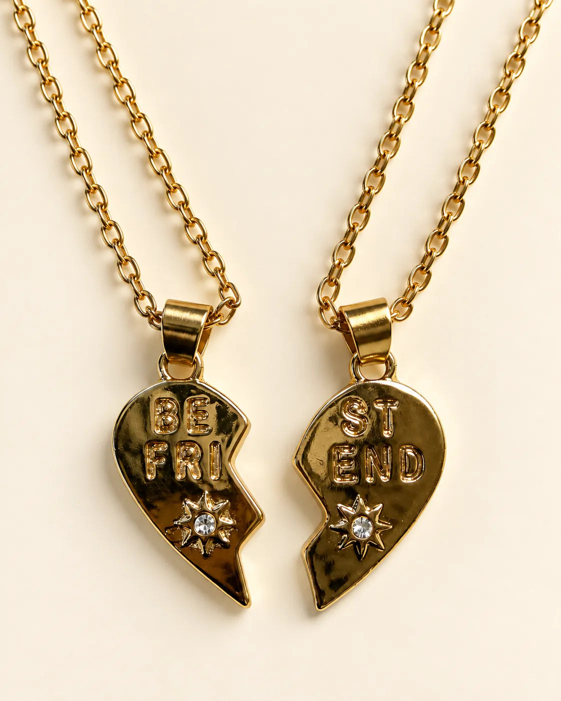 Close-up of the stamped gold heart halves with small zircon stars