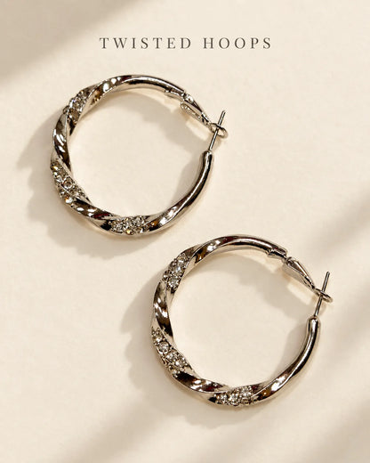 Silver twisted hoop earrings on a cream card with Twisted Hoops text
