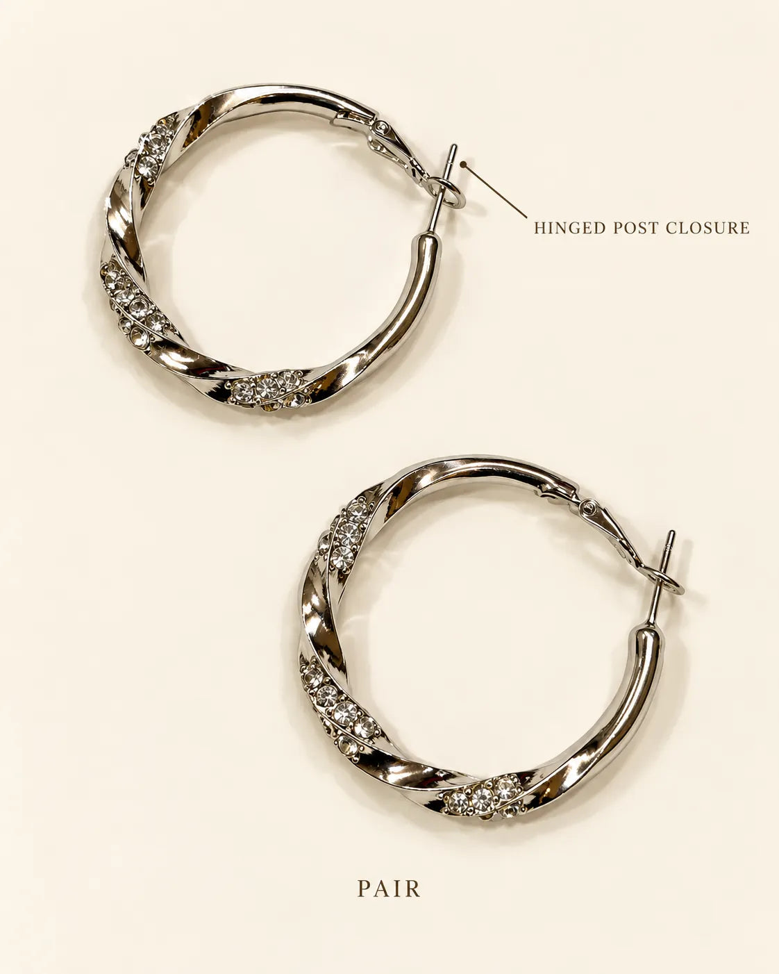 Annotated detail graphic of the silver twisted rhinestone hoop earrings