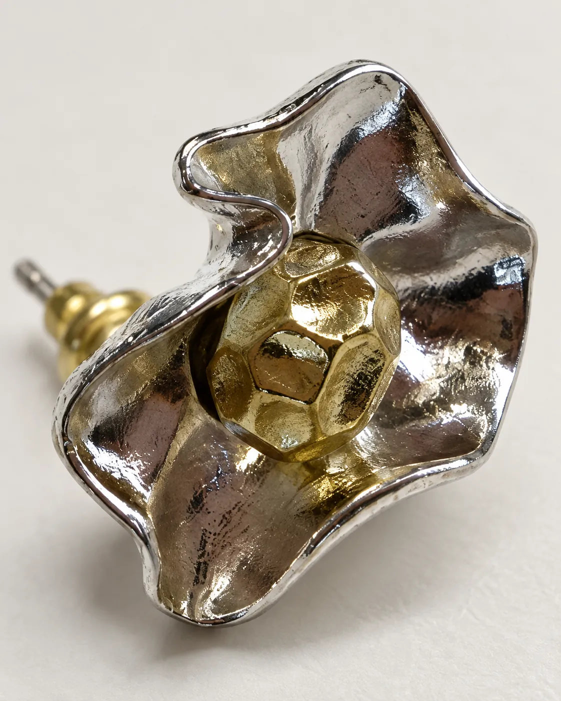 Close-up of the hammered gold-tone centre and folded silver-tone petals