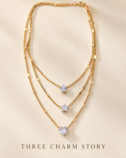 Gold layered crystal necklace with Three Charm Story text