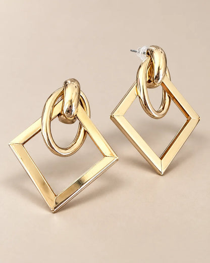 Angled view of the gold-tone double-loop and open square drop earrings