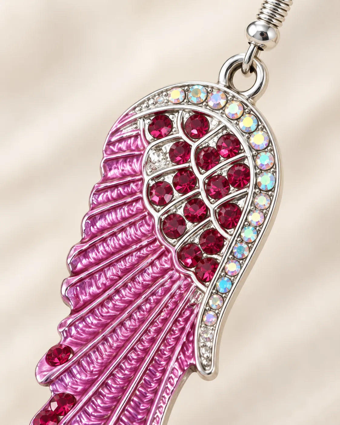 Close-up of the pink and red crystal cluster and silver-tone crystal border