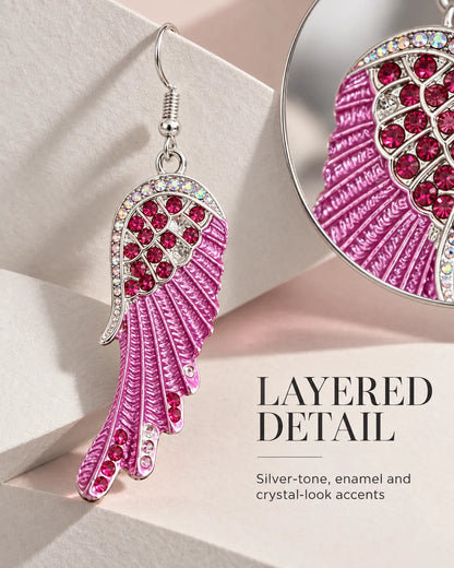 Layered detail graphic with a close-up of the pink wing's crystals