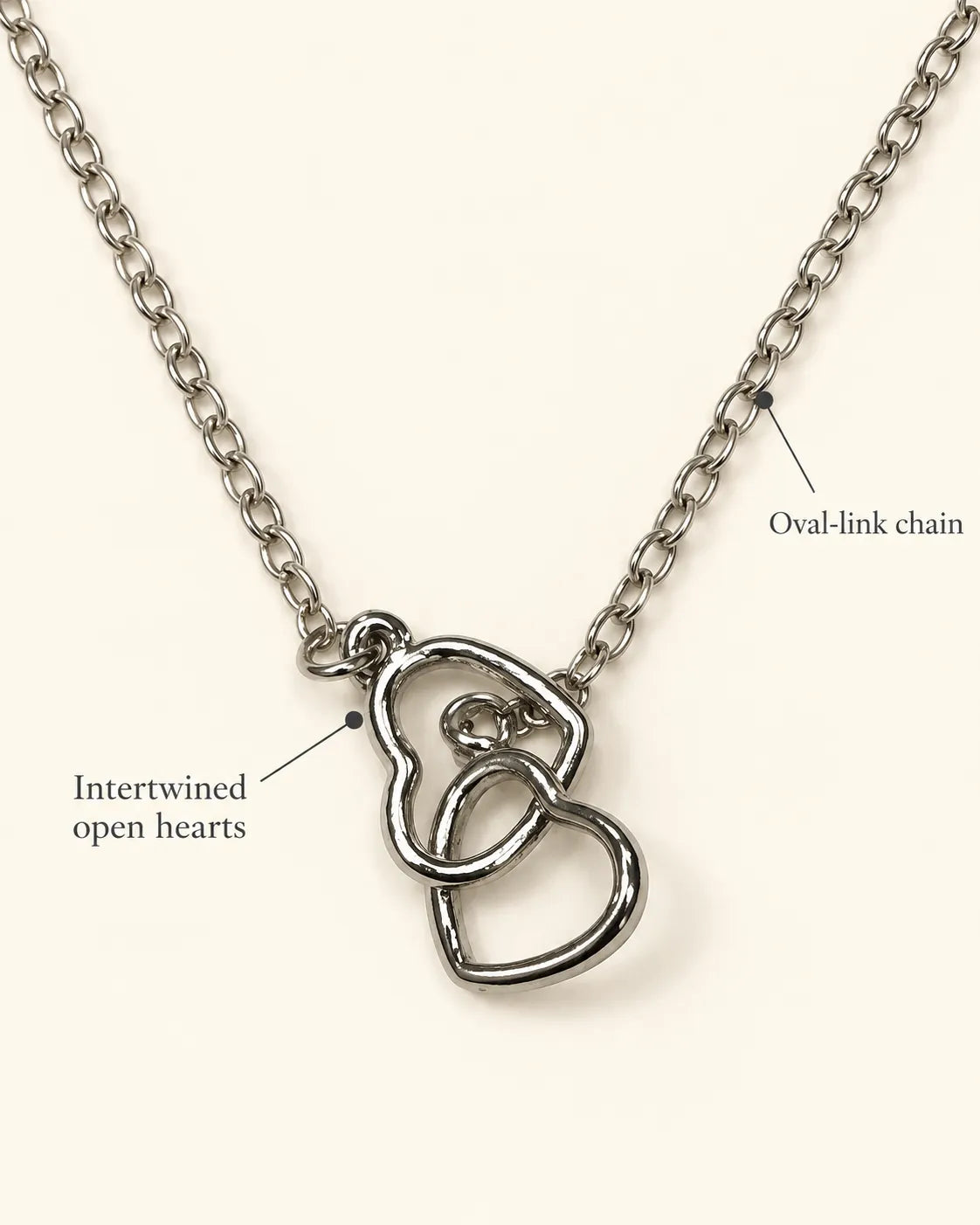 Annotated detail graphic of the intertwined silver hearts and chain