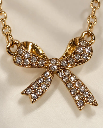 Macro detail of the pavé zircon bow loops and tails