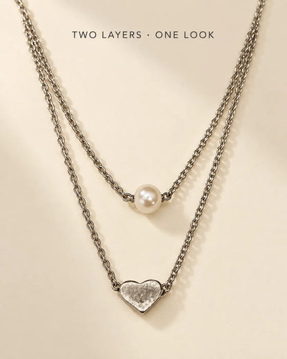 Silver layered pearl and heart necklace with Two Layers, One Look text