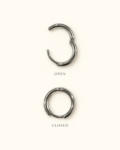 Graphic of a silver huggie hoop shown open and closed