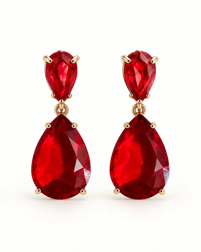 Red Elara two-stone teardrop earrings on a white background