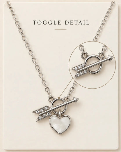 Silver toggle necklace with Toggle Detail text and a magnified arrow