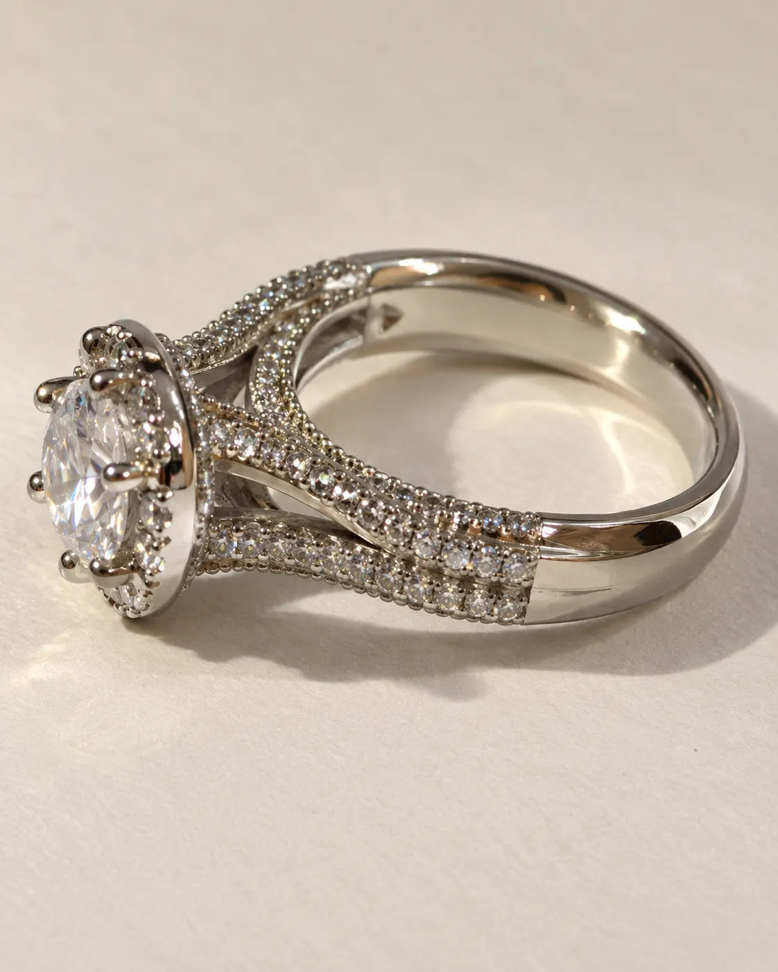 Silver halo solitaire ring with clear cubic zirconia and pavé split shank
