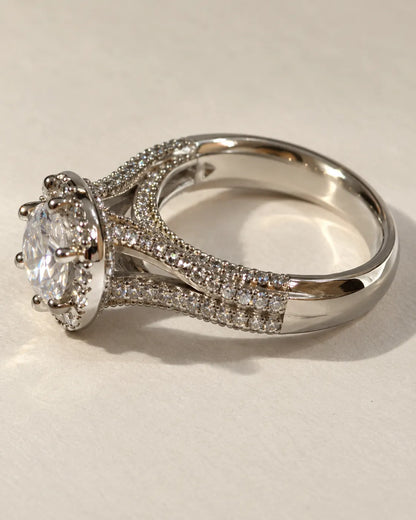 Silver halo solitaire ring with clear cubic zirconia and pavé split shank