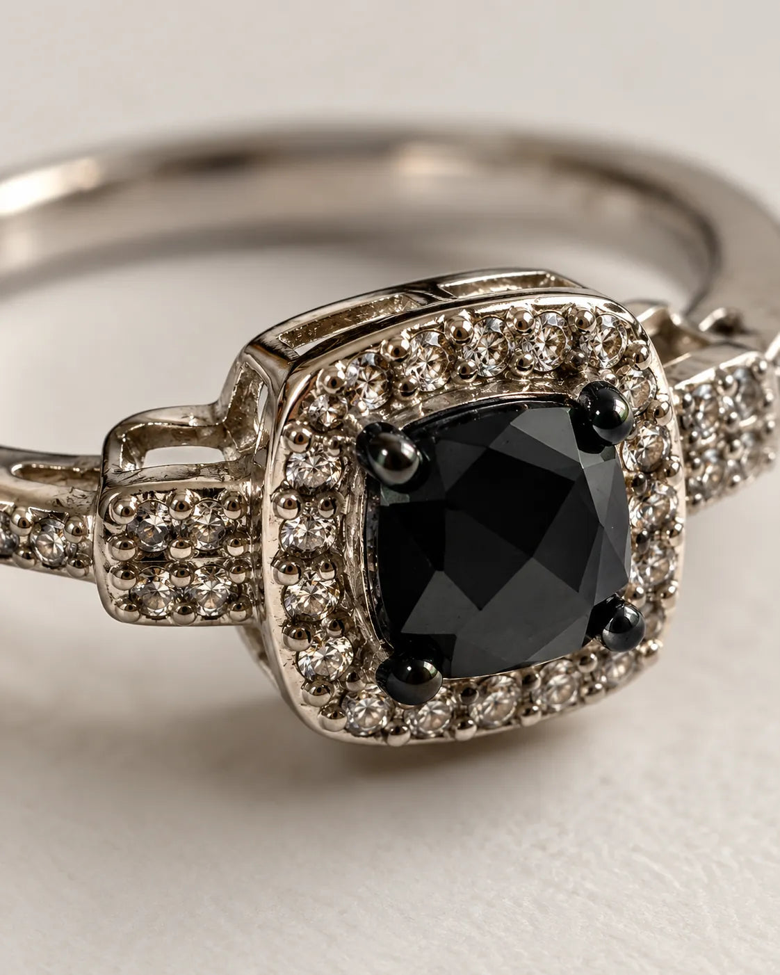 Close-up of the square black stone framed by a halo of clear stones
