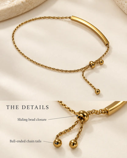 Details of the gold bar bracelet: sliding bead closure and ball-ended chain tails