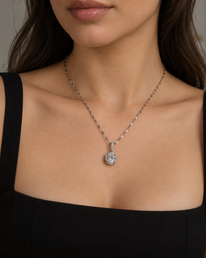Luna silver halo necklace worn with a black square-neck dress