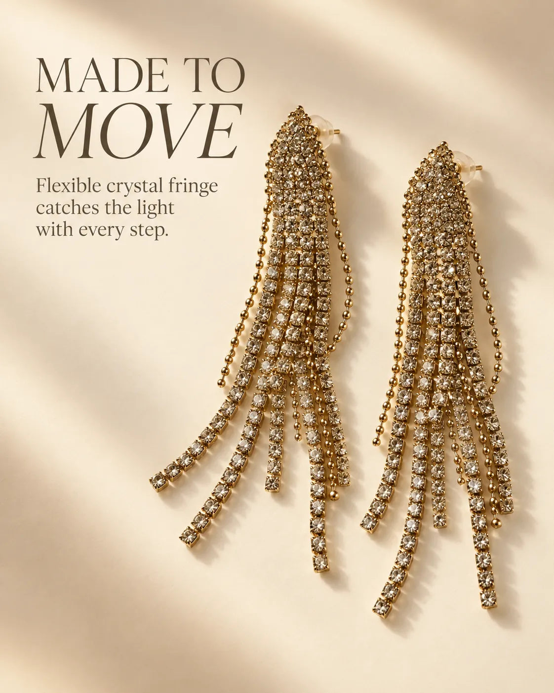 Made to move graphic of the white rhinestone fringe earrings