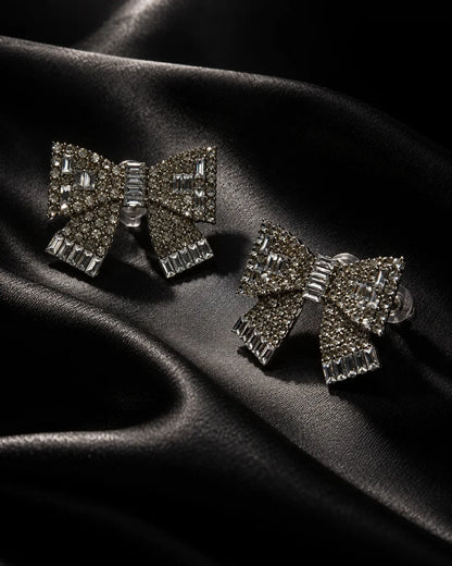 Clear rhinestone bow studs on black satin