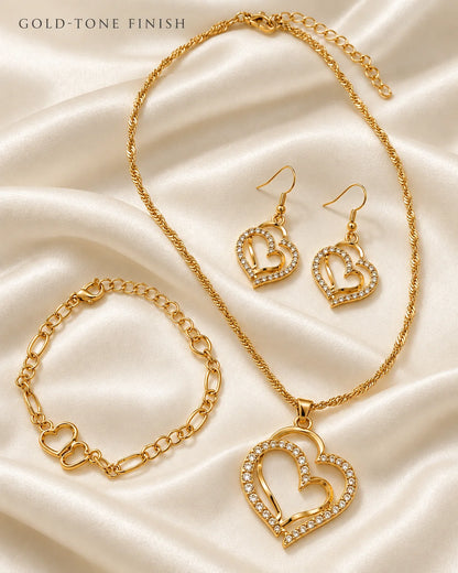 Gold double heart necklace, earrings and bracelet set on ivory satin