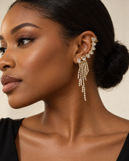 Profile of a woman wearing the gold heart crystal ear climber with a sleek bun