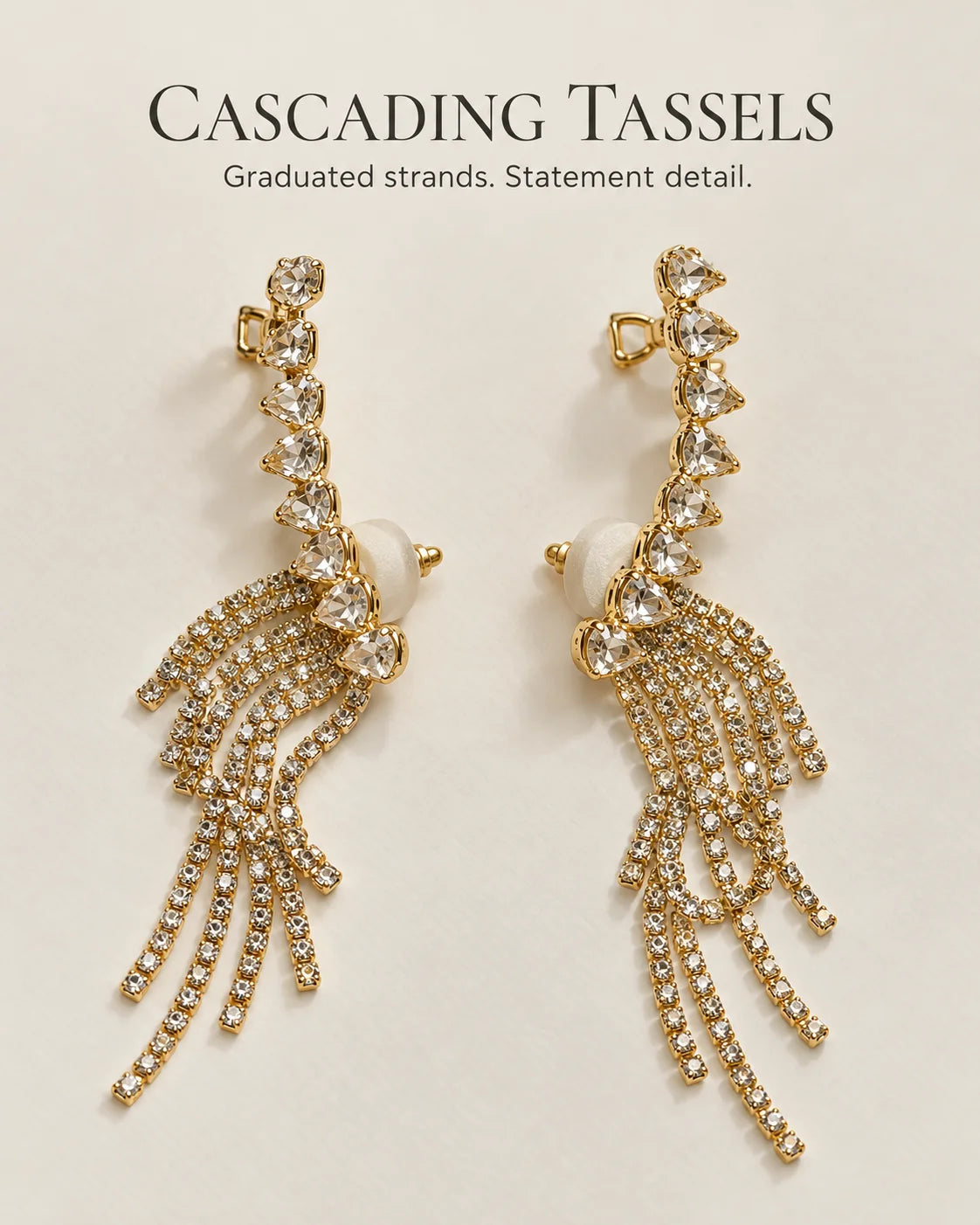 Cascading tassels: gold heart ear climbers with graduated rhinestone strands
