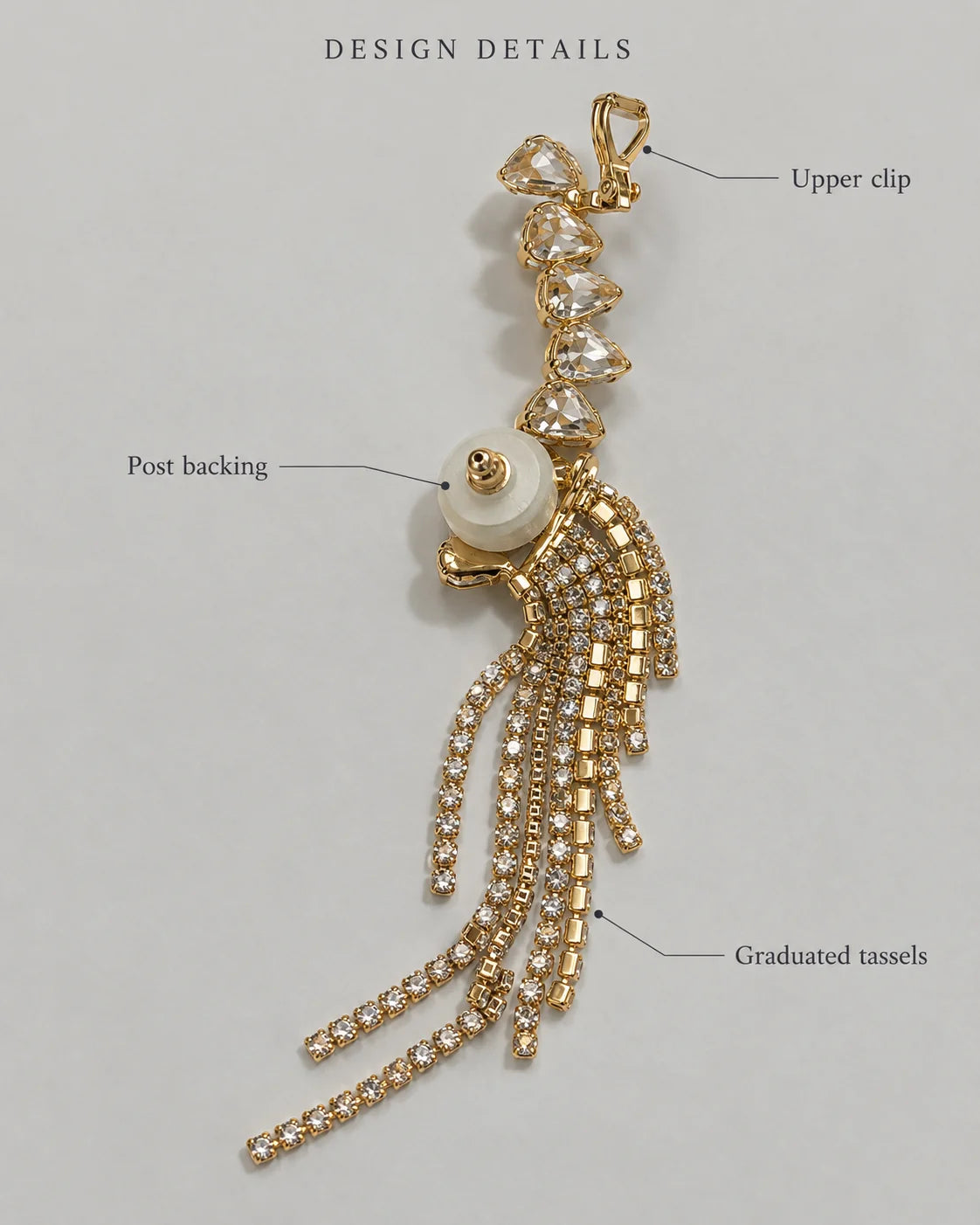Design details of the gold ear climber showing upper clip, post backing and graduated tassels
