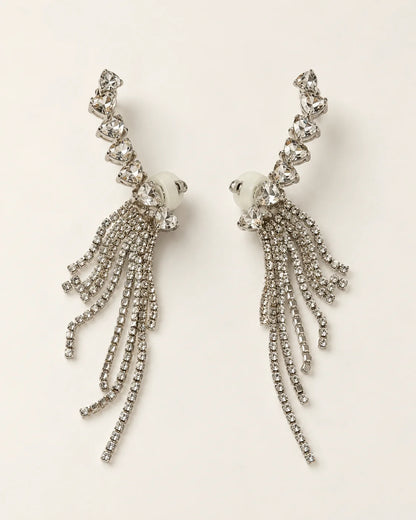 Cascade silver heart crystal tassel ear climber earrings, pair shown on cream