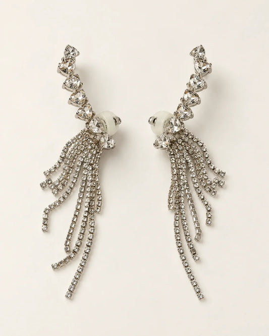 Cascade silver heart crystal tassel ear climber earrings, pair shown on cream