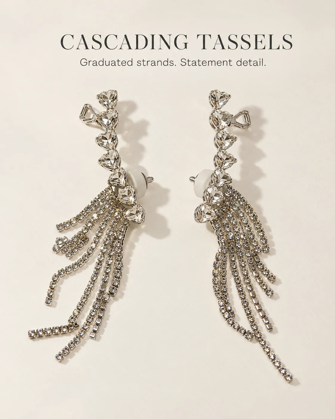 Cascading tassels: silver heart ear climbers with graduated rhinestone strands
