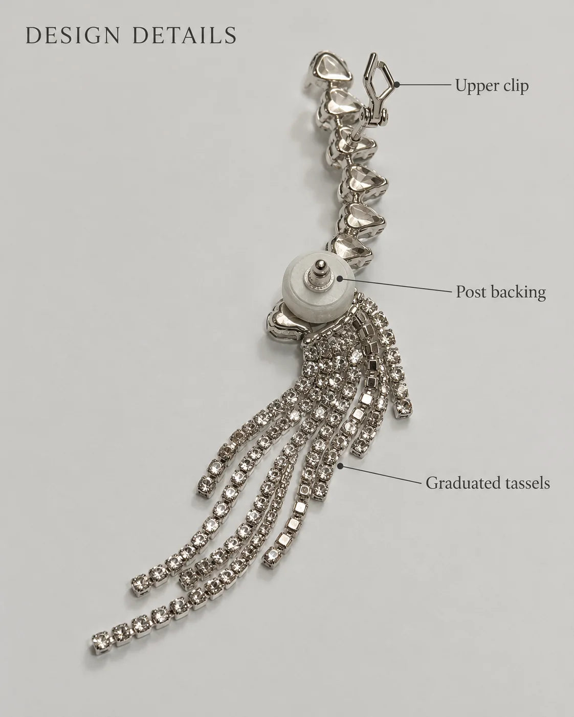 Design details of the silver ear climber showing upper clip, post backing and graduated tassels