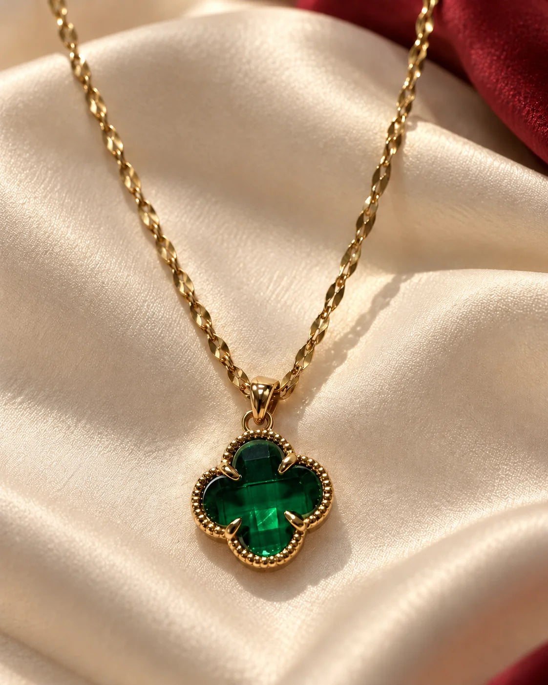 Fortuna emerald green clover necklace on cream satin